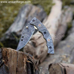 Folded Damascus Steel Pocket Knife with liner lock mechanism.
