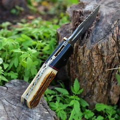 Handmade Damascus Pocket Knife with Twist Pattern Blade and Stag Antler Handle.