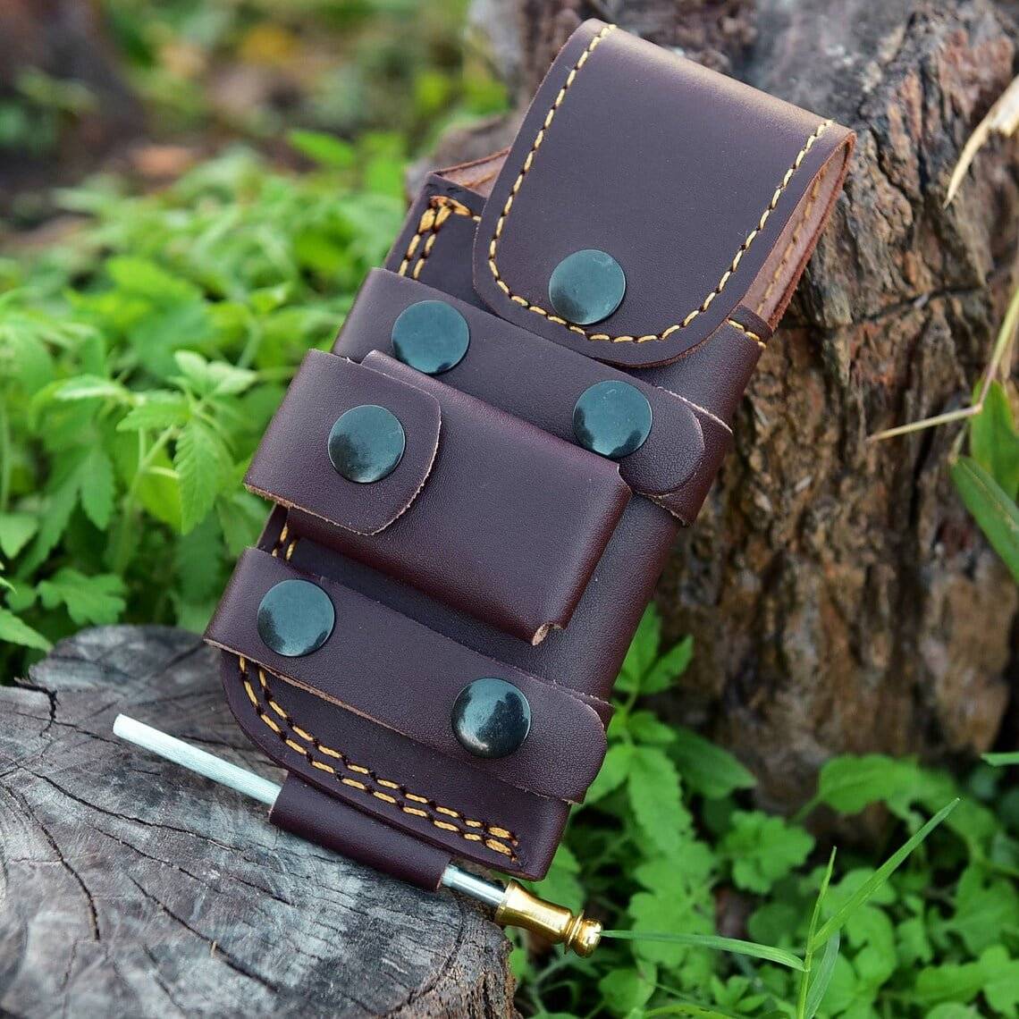 Leather sheath for Damascus folding tracker knife.
