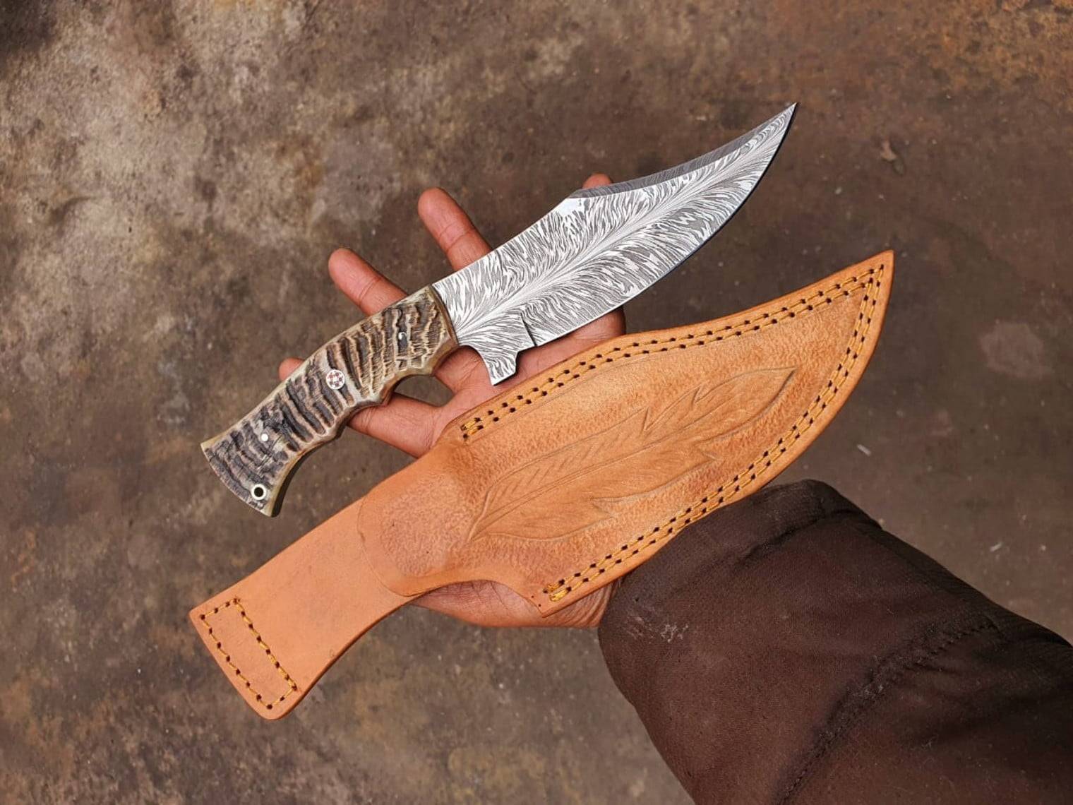 Blue Sheep Custom Handmade Damascus Steel Feather Pattern Hunting Knife with Himalayan sheep horn handle and leather sheath.