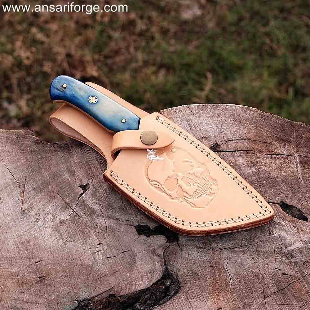 Honoo Damascus steel tanto knife securely stored in brown leather sheath.
