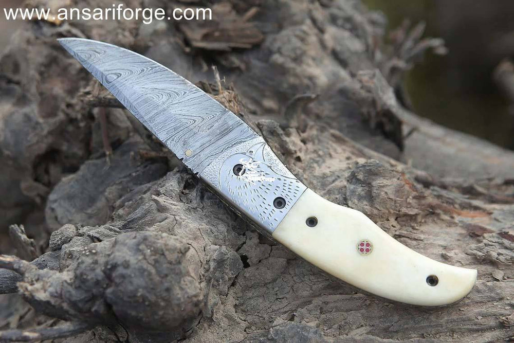 Sharp Eagle Damascus Pocket Knife: 1095 & 15N20 Damascus steel blade, camel bone handle, leather pouch.