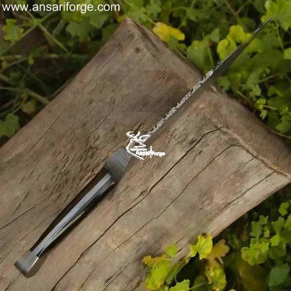 The Wanderer Damascus Bowie Knife: Hand-forged Damascus steel blade with a buffalo horn handle.