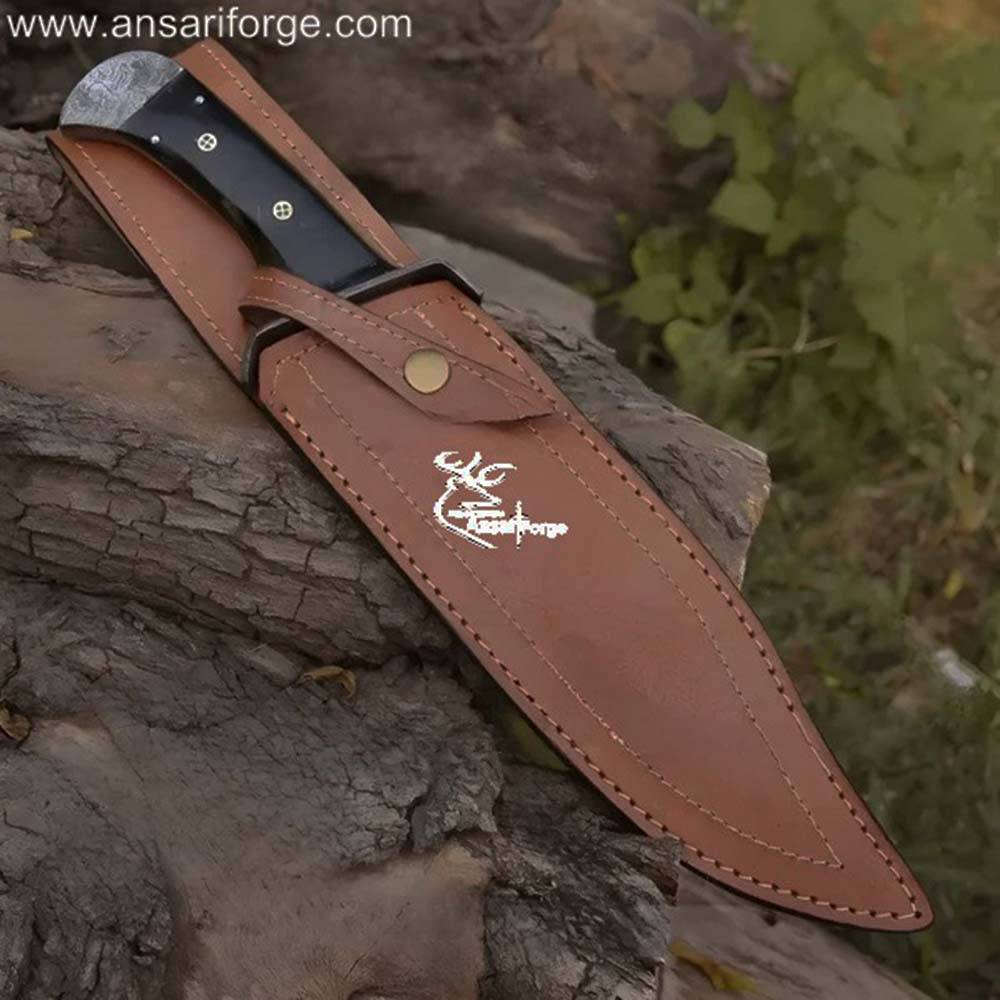 Damascus Bowie Knife In Leather Sheath : Hand-forged Damascus steel blade with a buffalo horn handle.