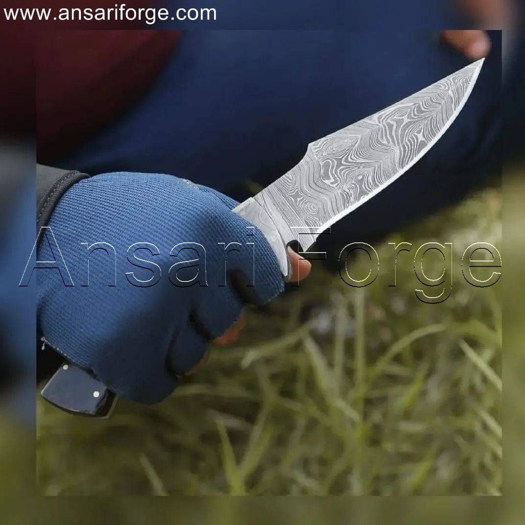 Handmade Damascus Steel Hunting Knife in hand