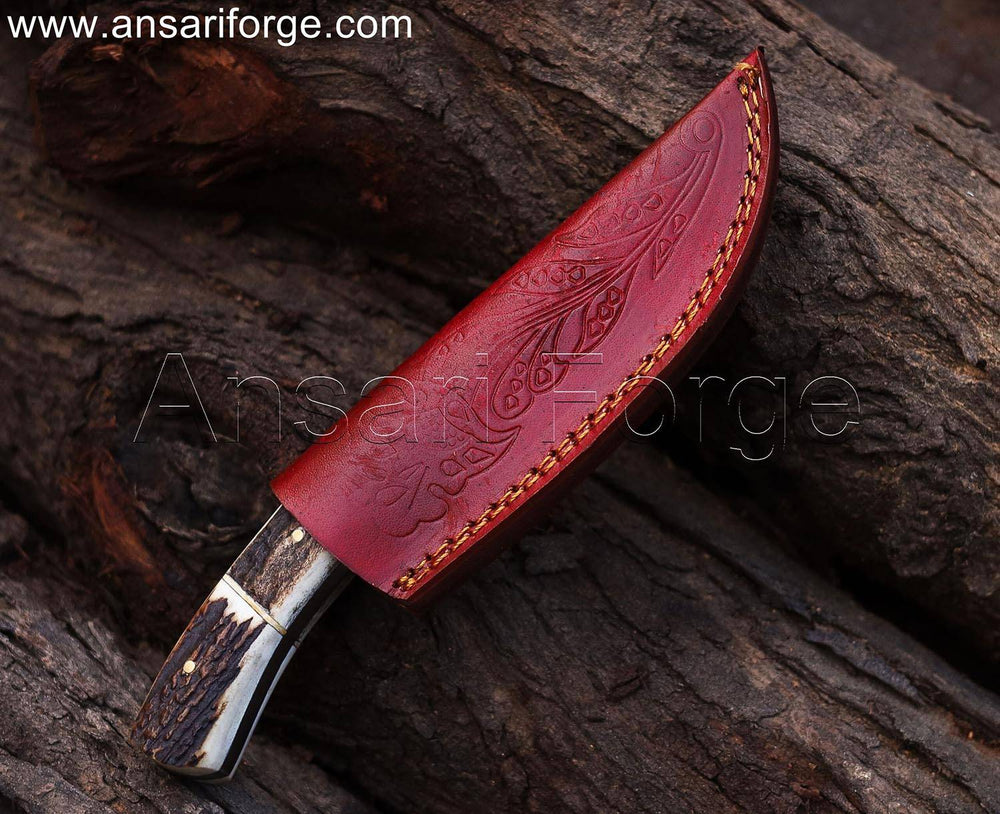 Engraved knife in leather sheath