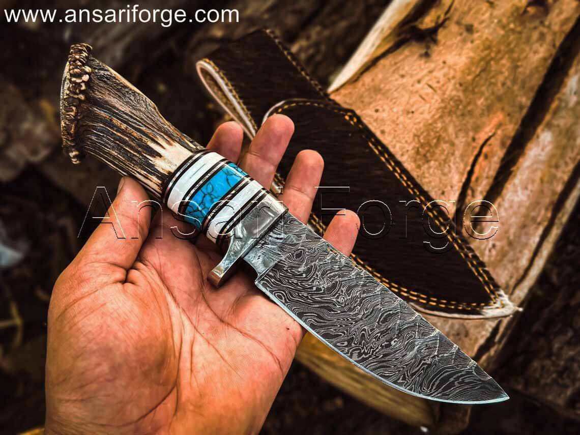 Rime Damascus Steel Antler Handle Knife Held in Hand, Ready for Adventure