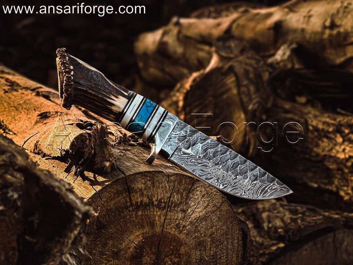 Rime Fixed Blade Antler Handle Damascus Knife Displayed on a Rustic Wooden