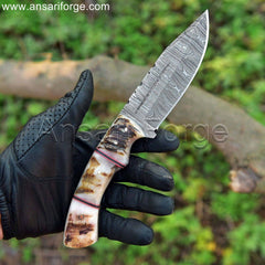 Handmade Damascus Hunting Knife with Leather Sheath. Fixed blade for versatile use in hunting and field dressing. Ram horn handle for secure grip.