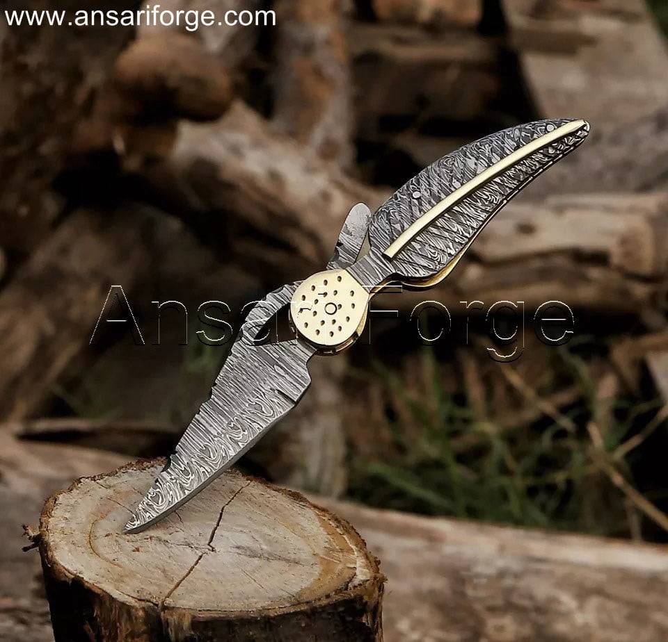 Custom Damascus pocket knife with hand-forged blade and handle.