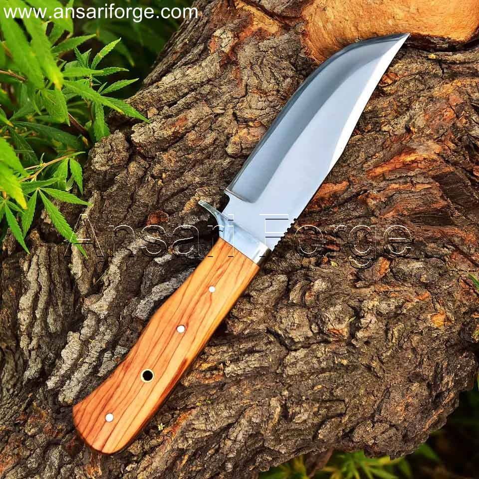Handcrafted fixed blade hunting knife with drop point D2 steel blade, olive wood handle, and leather sheath. Perfect for camping, hiking, and wilderness adventures.