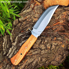 Handcrafted fixed blade hunting knife with drop point D2 steel blade, olive wood handle, and leather sheath. Perfect for camping, hiking, and wilderness adventures.