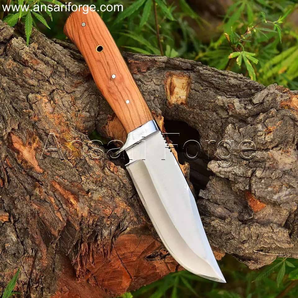 fixed blade hunting knife with a D2 steel drop point blade and a polished olive wood handle.