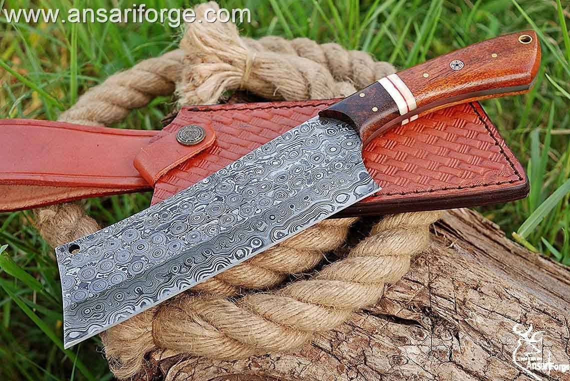 Custom handmade Damascus steel cleaver chopper chef knife Damascus steel 1095 & 15n20 hand forged rain drop pattern cleaver blade with 58 - 60 HRC hardness .  Rosewood handle and bolsters . Comes with genuine cowhide leather sheath