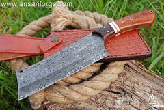 Custom handmade Damascus steel cleaver chopper chef knife Damascus steel 1095 & 15n20 hand forged rain drop pattern cleaver blade with 58 - 60 HRC hardness .  Rosewood handle and bolsters . Comes with genuine cowhide leather sheath