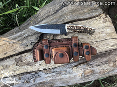 Natural stag antler handle on hand forged 1095 steel knife with scout carry leather sheath.