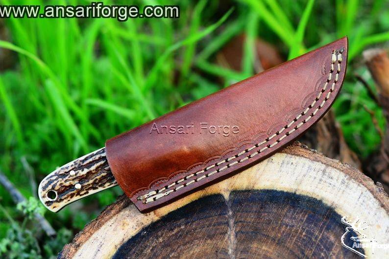 Damascus steel hunting knife with stag handle