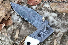 Handcrafted Damascus Steel Folding Knife with Stag Antler Handle.
