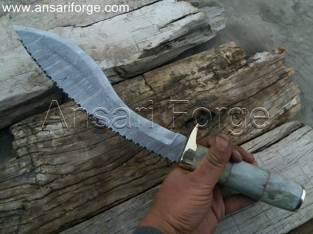 Close-up view of a beautiful Damascus kukri knife with a camel bone handle, leather sheath, and distinct layered blade pattern.