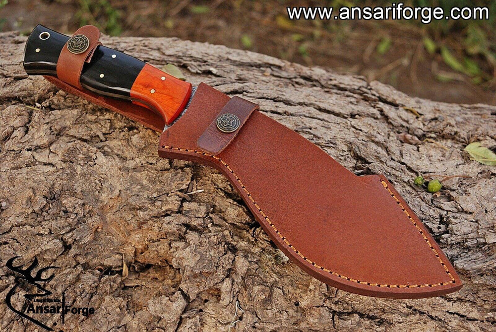 Hand-forged Damascus steel hunting knife with a curved blade, buffalo horn handle, and Pakka wood bolsters.