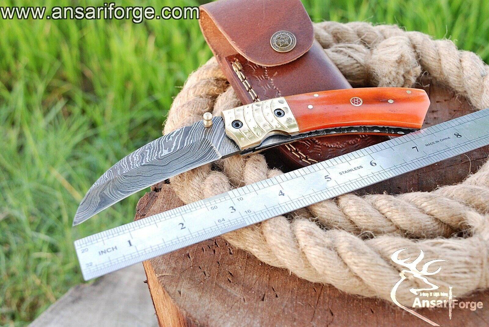 Handmade Damascus steel folding knife with leather pouch