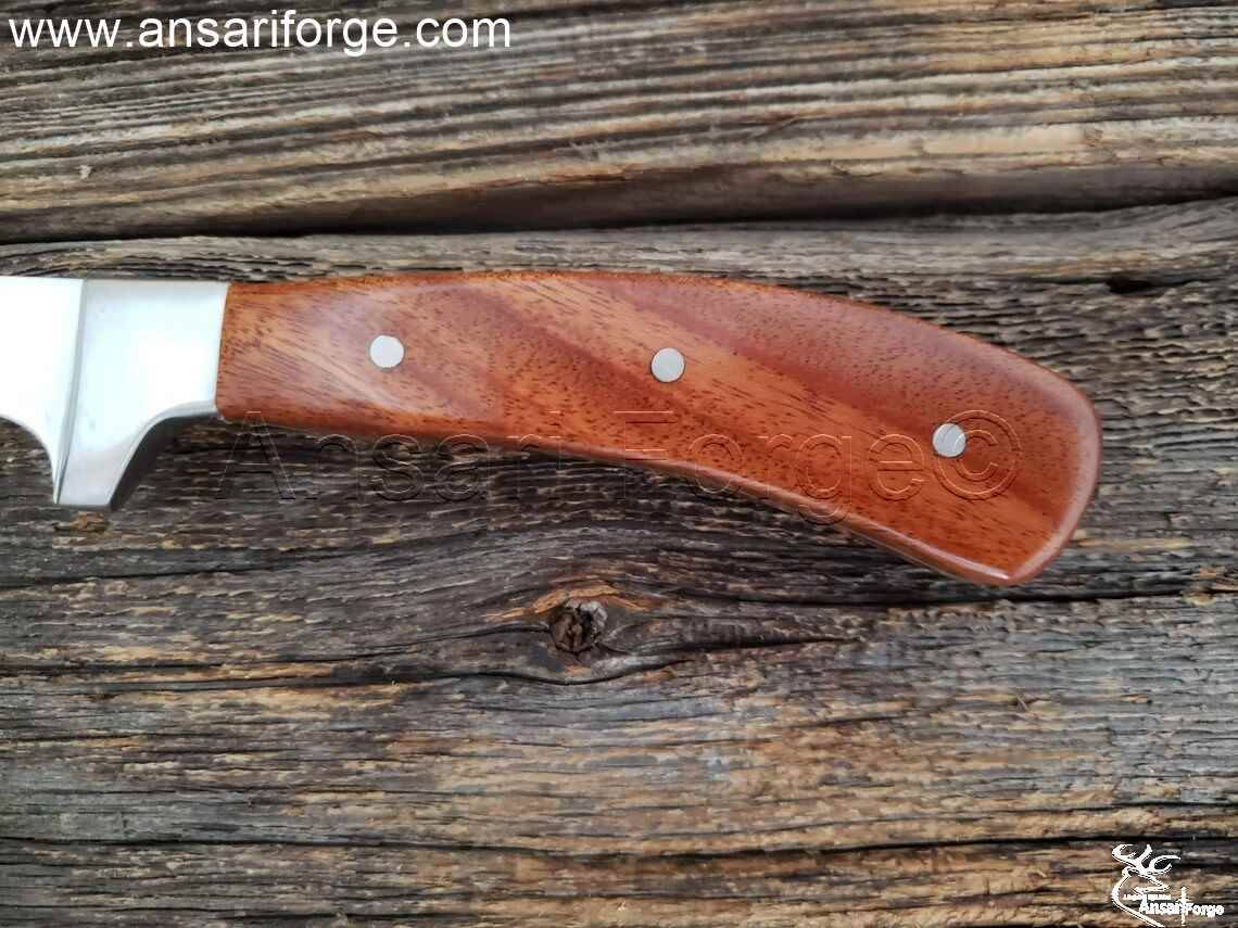 Wood handle of filleting knife.
