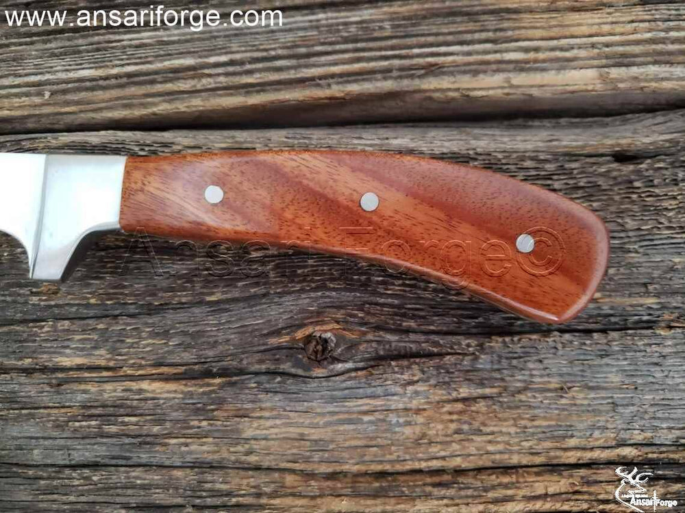 Wood handle of filleting knife.