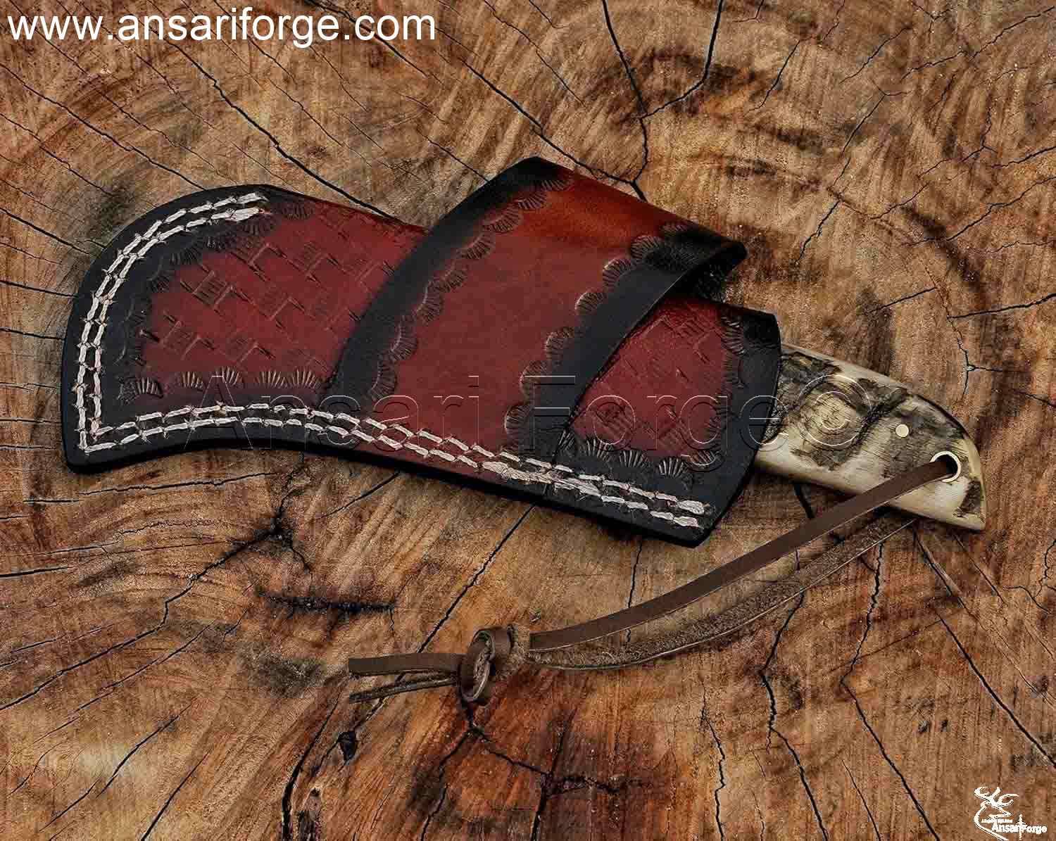 Ansari Forge Hawkbill knife in a handmade leather sheath.