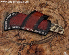 Ansari Forge Hawkbill knife in a handmade leather sheath.