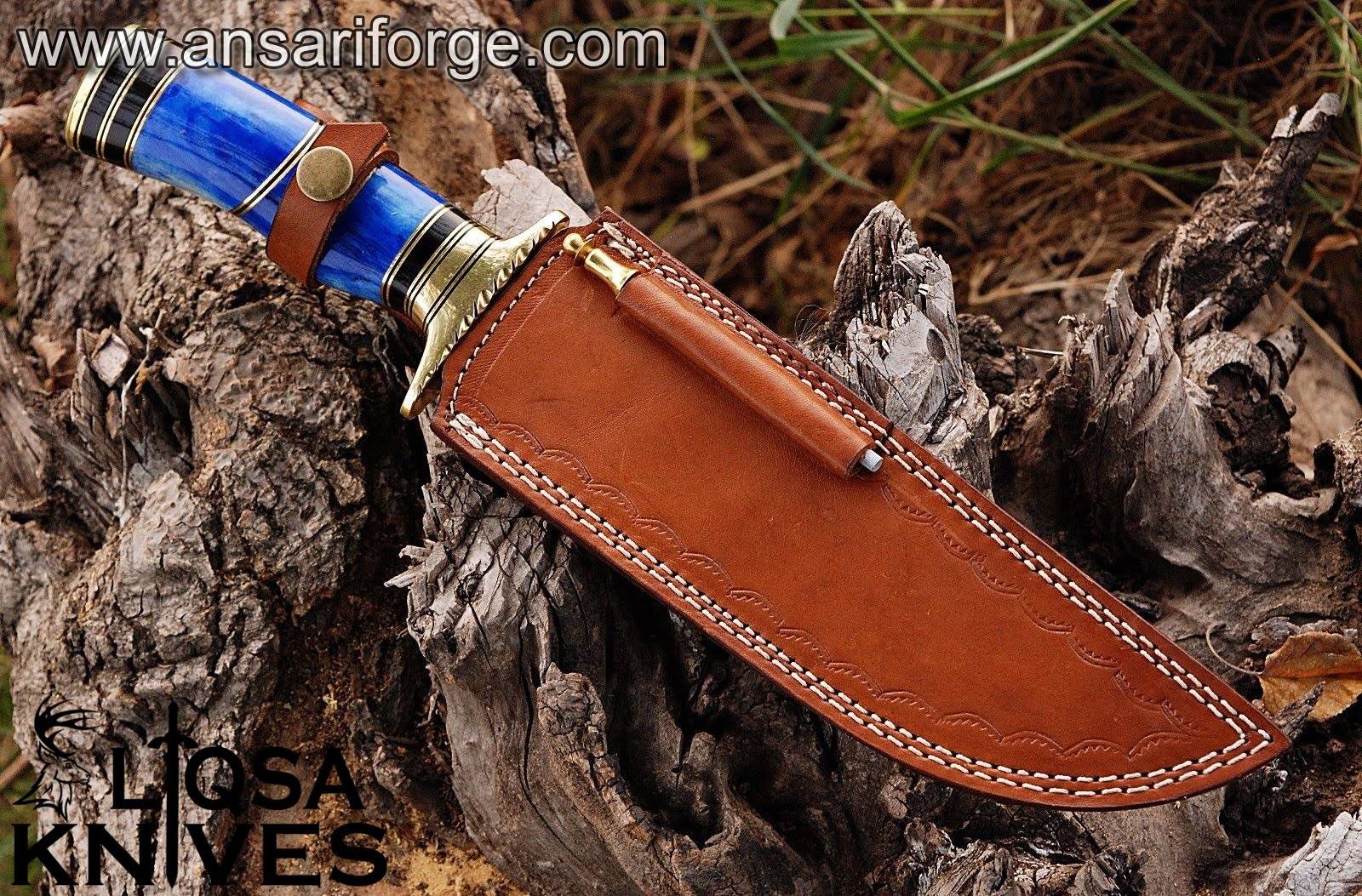 Damascus Bowie knife it its leather sheath.