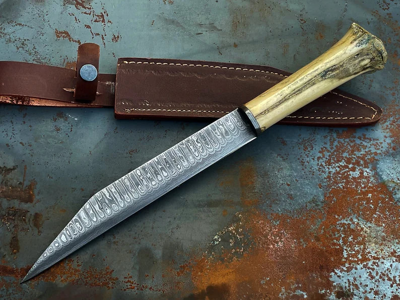 Viking Seax Knife with hand-forged Damascus steel blade and camel bone handle. Leather sheath included.