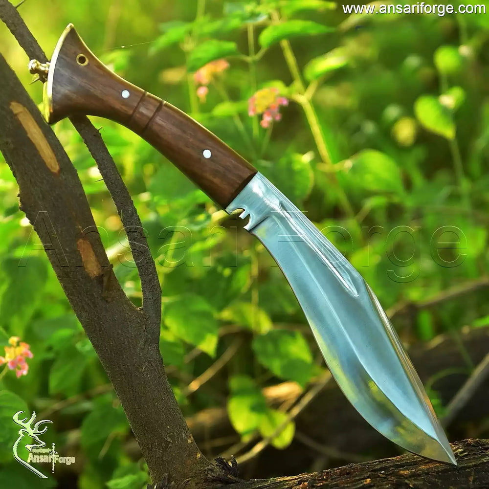 Close-up of the Kukri's full tang wooden handle and pure brass pommel by Ansari Forge.
