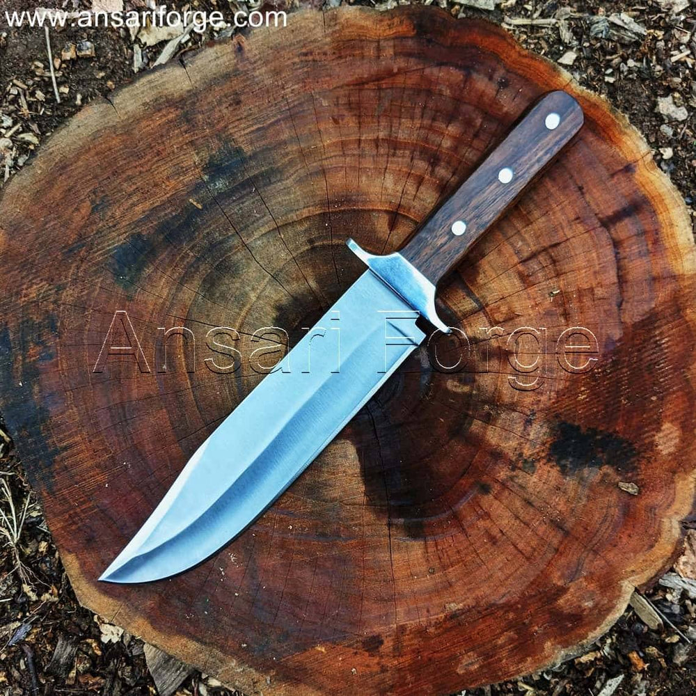 Red Dead Redemption 2 Bowie Knife with clip-point blade, leather sheath, on a rustic wooden surface.