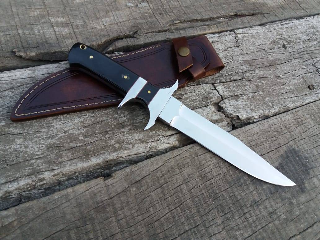 A timeless Loveless Knife, a classic design passed down through generations. The intricate details of the handle and sheath showcase the knife's quality and craftsmanship.