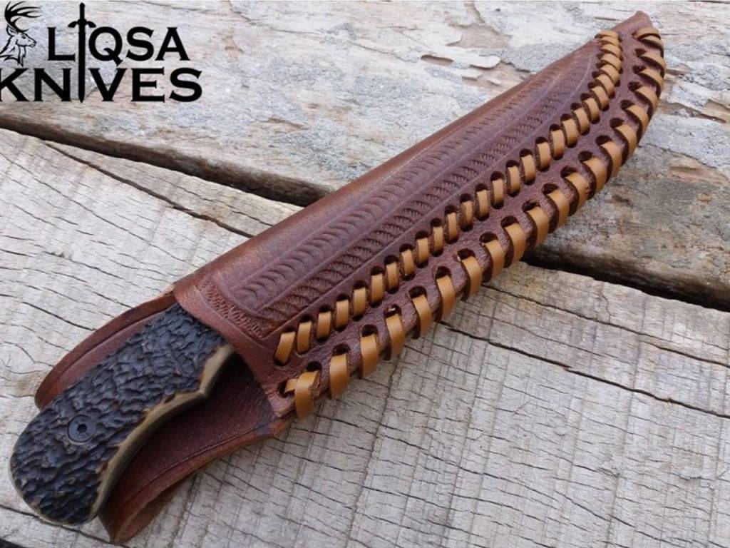 Damascus Steel Fixed Blade Antler Handle Knife Secured In Real Leather Brown Sheath.