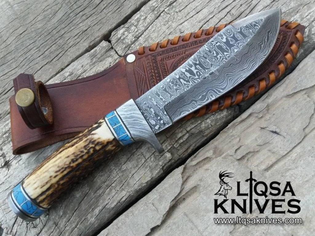 Deer Antler Handle Knife with a 600-layer ladder Damascus steel blade and a handmade leather sheath. On sale