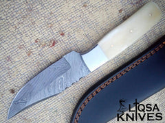 Bone Handle Damascus Knife with a beautifully twisted blade pattern and camel bone handle, showcasing exquisite craftsmanship.