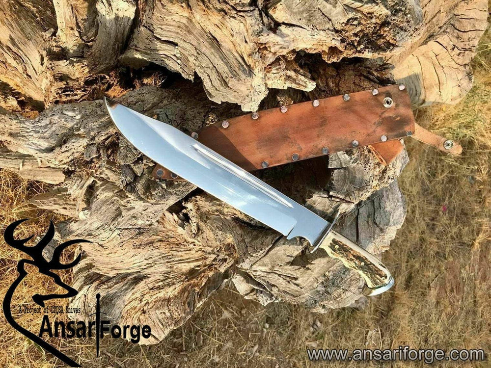 Custom D2 steel Bowie knife with stag antler handle, mirror-polished 11-inch blade, and leather sheath. Handcrafted by Ansari Forge.