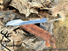Custom D2 steel Bowie knife with stag antler handle, mirror-polished 11-inch blade, and leather sheath. Handcrafted by Ansari Forge.
