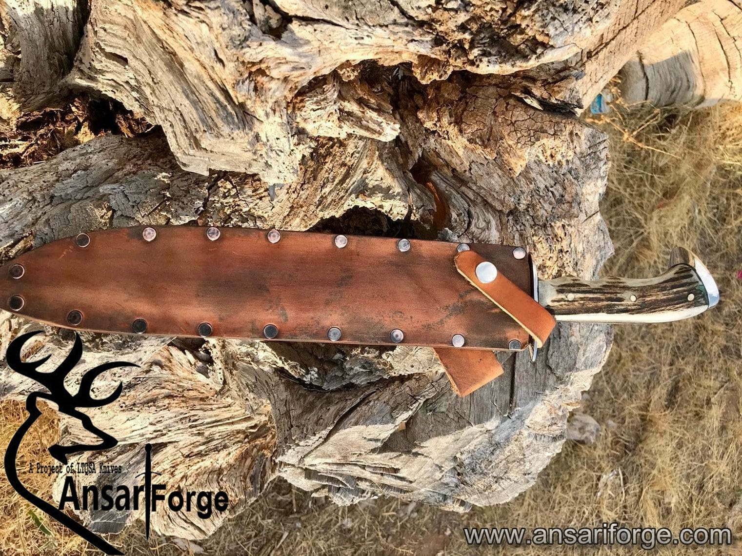 Custom D2 steel Bowie knife with stag antler handle, mirror-polished 11-inch blade, and leather sheath. Handcrafted by Ansari Forge.