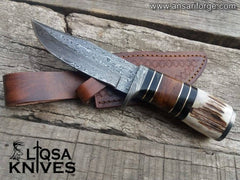 Handmade Custom Damascus Hunting Knife with Stag Antler Handle and Rain Drop Pattern.