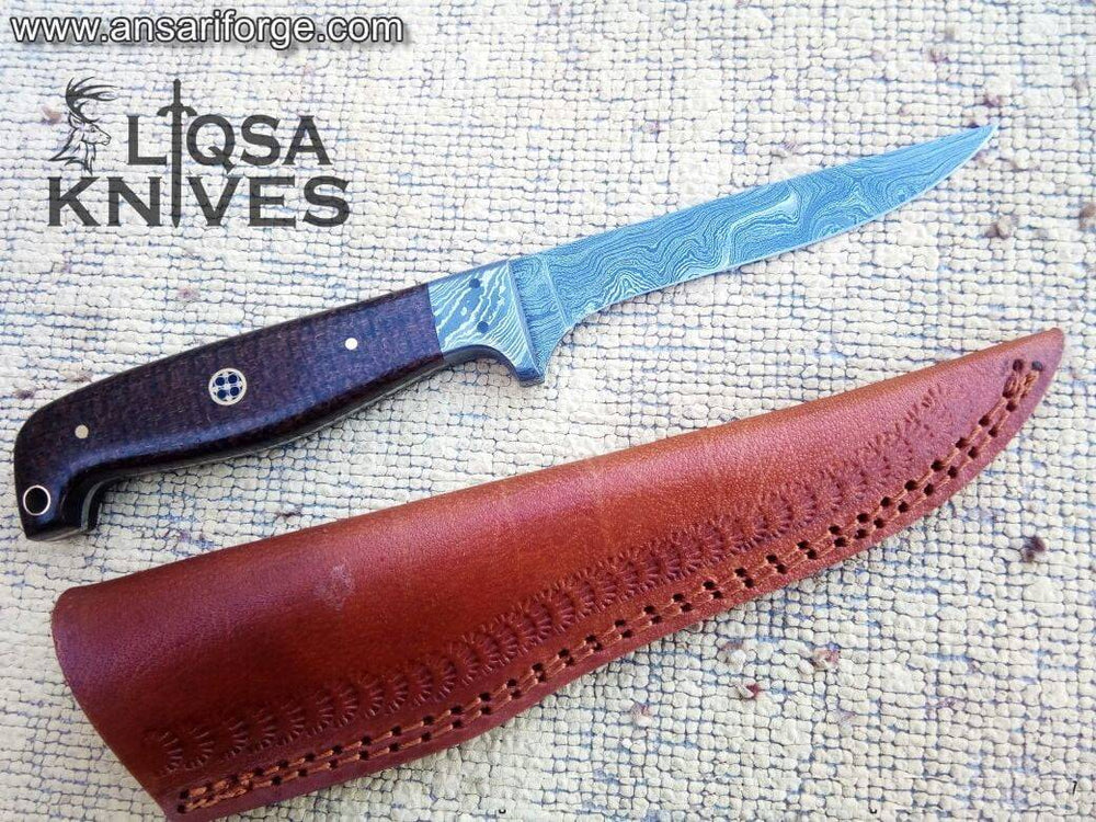 Damascus steel trout fillet knife with a twist pattern blade, resting on a wooden cutting board.