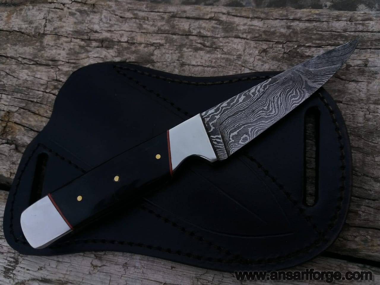 Damascus steel fixed blade skinner with bull horn handle