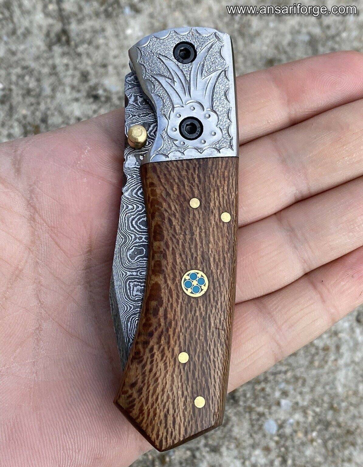 Custom Damascus Folding Knife closed with its leather sheath, ready for everyday carry.